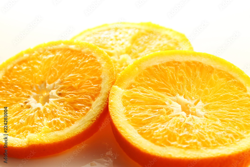 Orange Slice on white background / Orange is a citrus fruit that is quite delicious, juicy with high content Vitamin C. Orange Slice on white background / Orange is a citrus fruit that is quite delicious, juicy with high content Vitamin C.