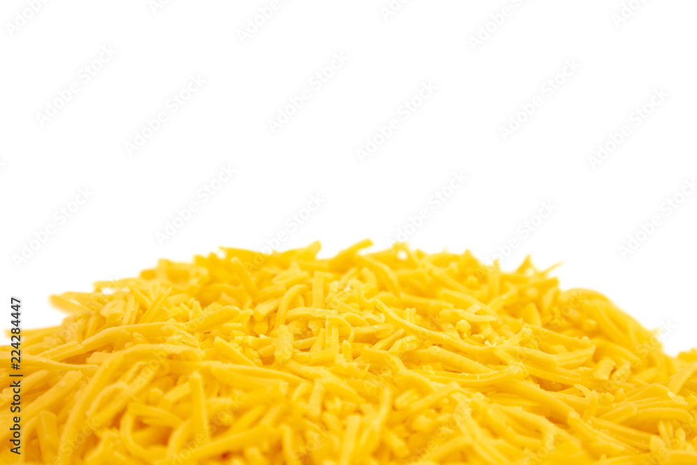 Pile of Grated Cheddar Cheese on a White Background Pile of Grated Cheddar Cheese on a White Background