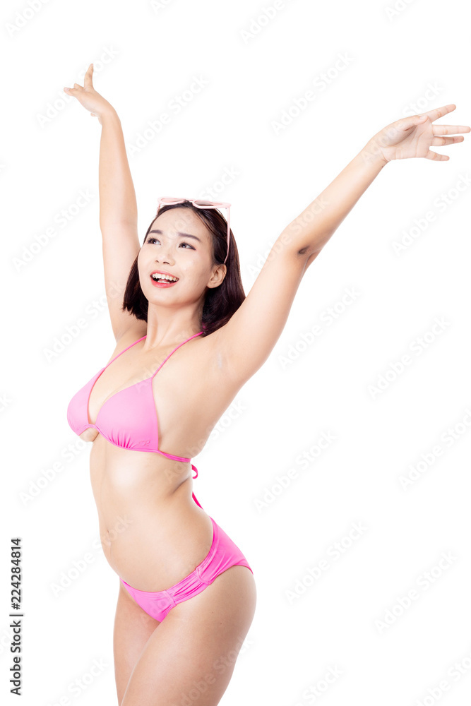 Attractive beautiful asian woman wear sexy pink bikini. Charming beautiful young woman gets happy, cheerful with smiley face. Pretty woman love summer season and travel beach isolated white background Attractive beautiful asian woman wear sexy pink bikini. Charming beautiful young woman gets happy, cheerful with smiley face. Pretty woman love summer season and travel beach isolated white background