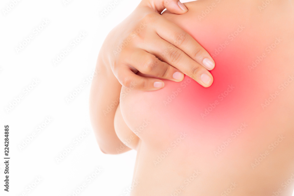 Fototapeta premium Beautiful young woman is examining breasts for checking breast cancer. Attractive beautiful woman get afraid about breast cancer. She get breasts cancer and worry about it isolated on white background