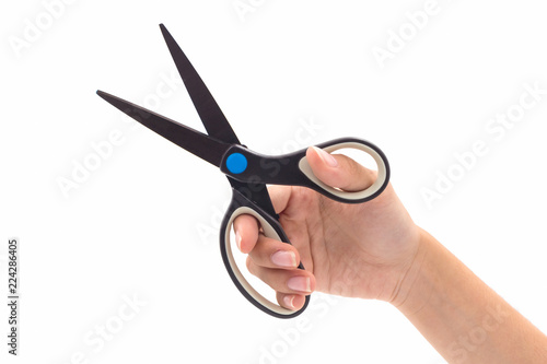 Closeup hand holding black steel scissors.