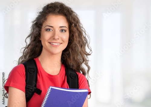 Portrait of a cute young student girl