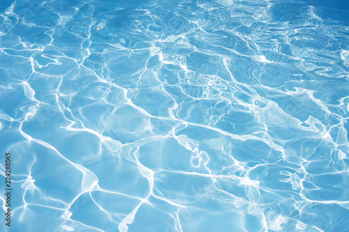 Texture of water in swimming pool for background