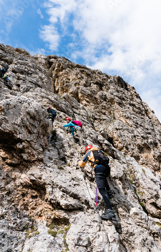 young attractive female mountain climber in the Dolomites of italy
