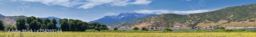 Panoramic Landscape view from Heber, Utah County, view of backside of Mount Timpanogos near Deer Creek Reservoir in the Wasatch Front Rocky Mountains, and Cloudscape. Utah, USA. photo