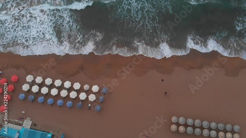 Mediterranean ocean beach waves in motion, (Greece) drone track shot. photo