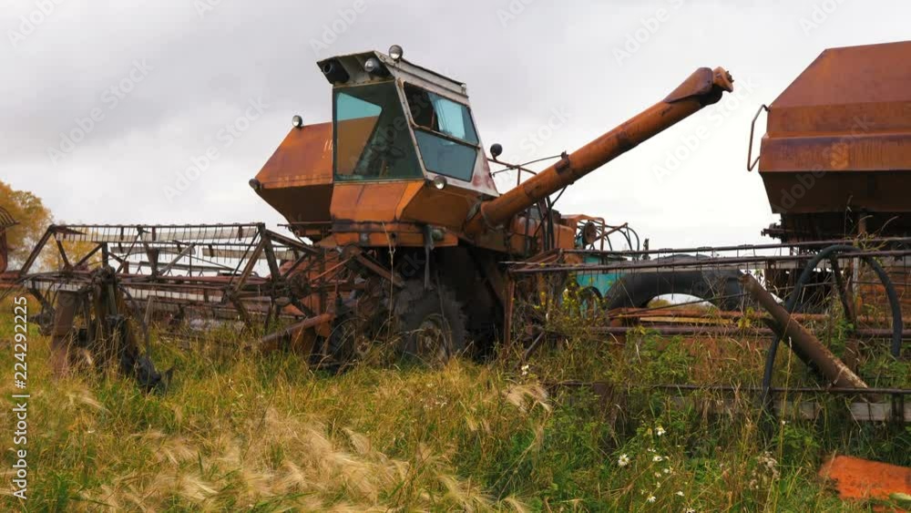 Old ruined harvester in the field Old ruined harvester in the field