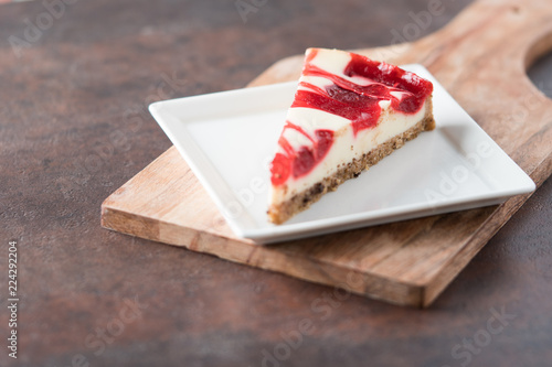 strawberry raspberry swirl cheesecake slice 