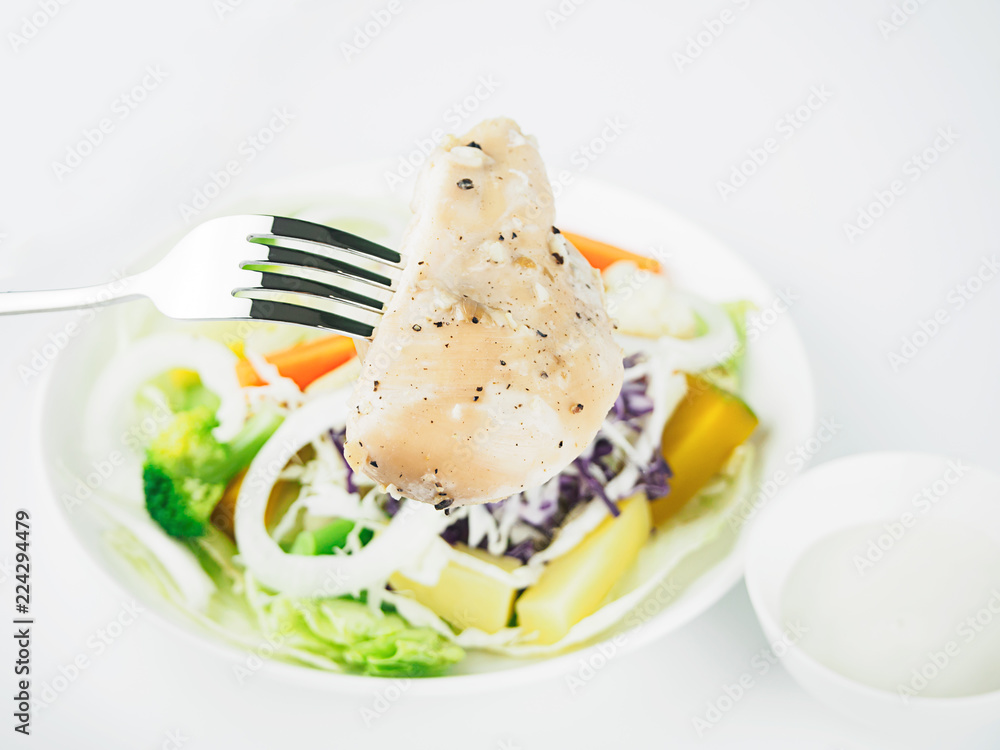 Pepper chicken with salad on white background Pepper chicken with salad on white background