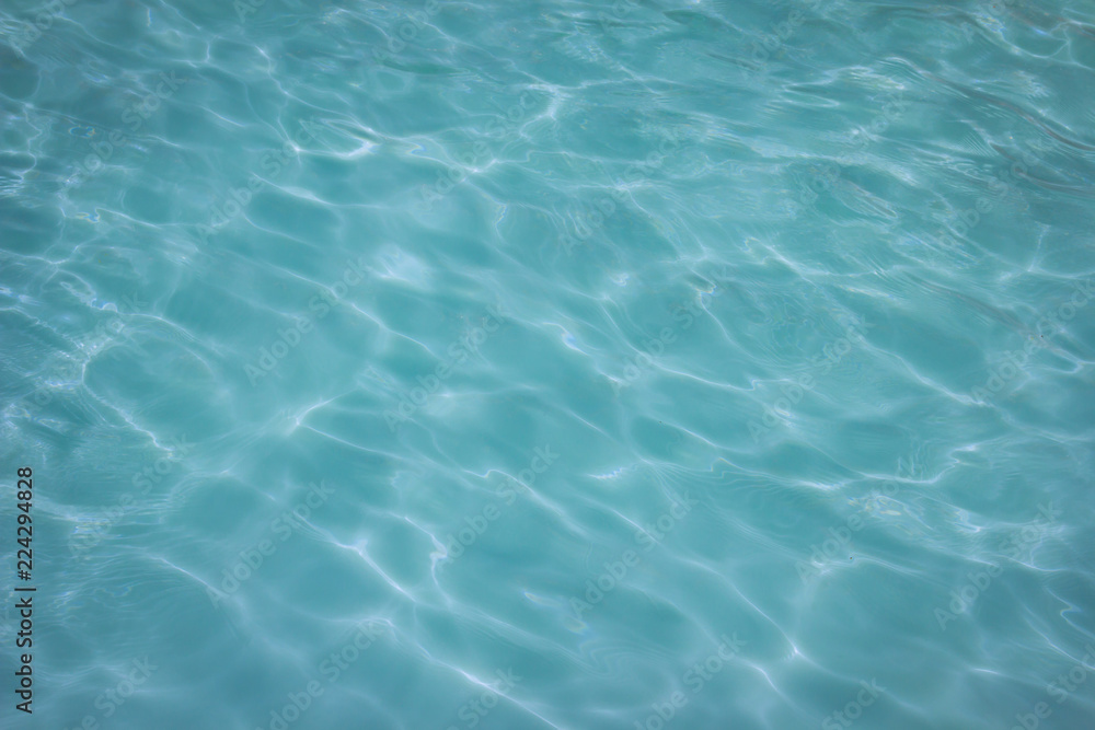 swimming pool with sunny reflections background