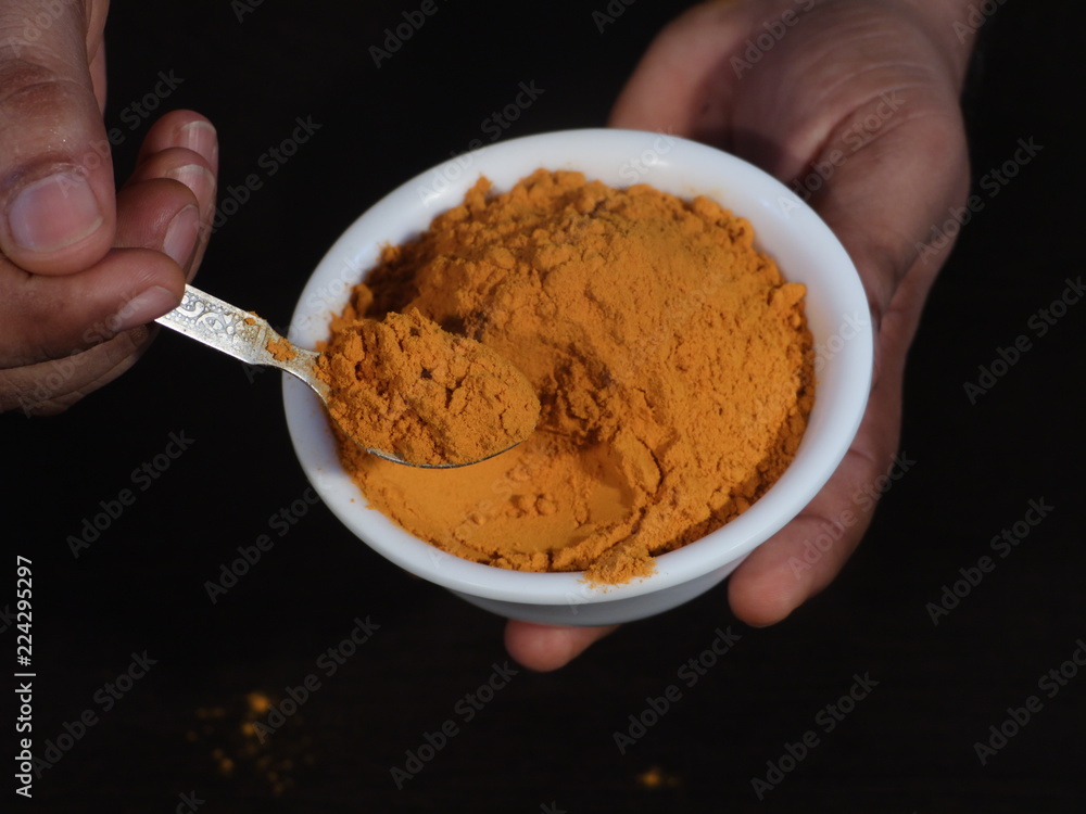 Turmeric powder and fresh turmeric on wooden background, Turmeric Powder in White Bowl on Wooden Background,Turmeric Powder in Spoon, Haldi , Haladi Powder Called in India, Turmeric Turmeric powder and fresh turmeric on wooden background, Turmeric Powder in White Bowl on Wooden Background,Turmeric Powder in Spoon, Haldi , Haladi Powder Called in India, Turmeric