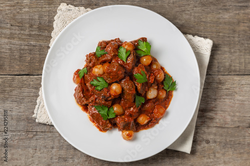 A traditional Greek dish of beef stifado in a sauce. 