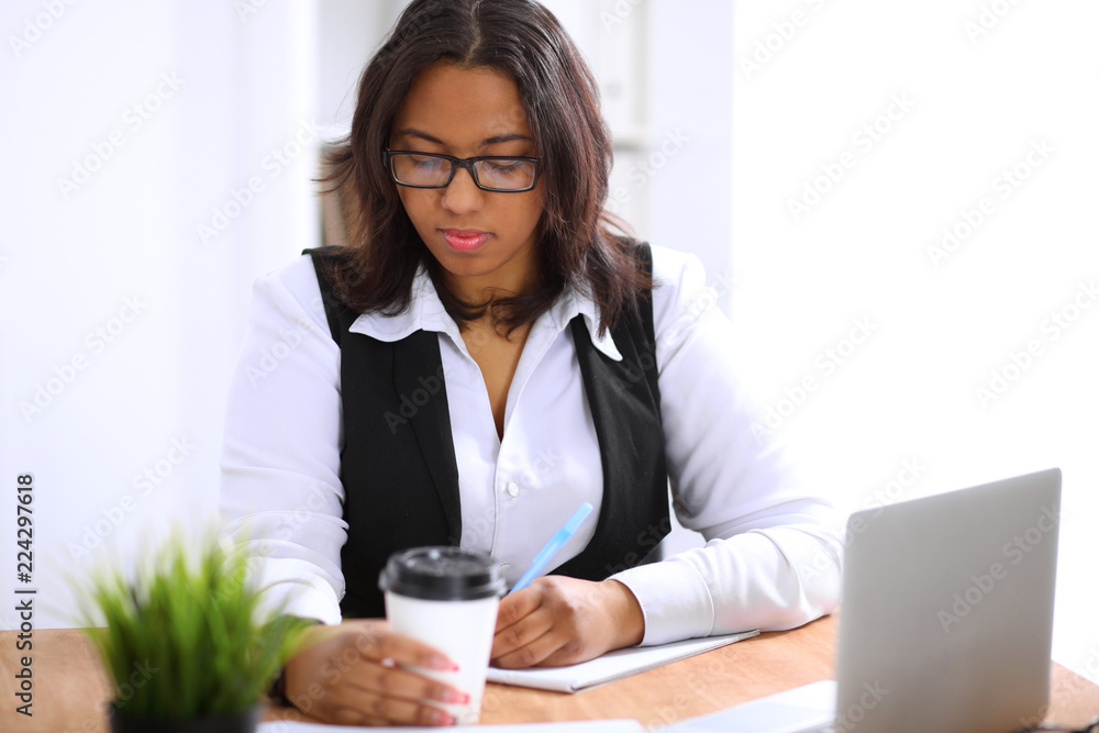 African American business woman is busy with paper job in office African American business woman is busy with paper job in office