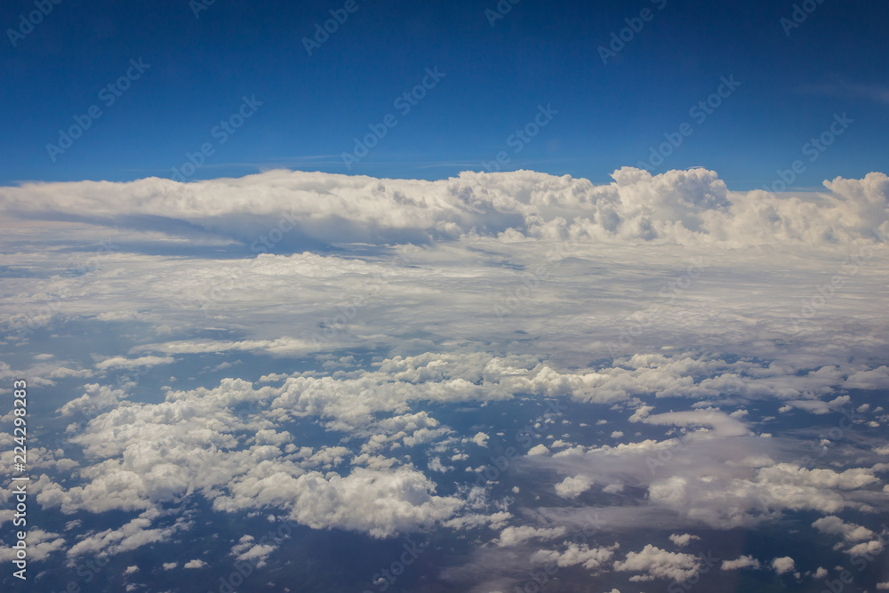 Blue sky with clouds background on the airplan