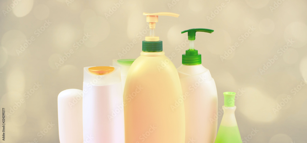 Banner Cosmetics for hair and body care white bottles on a gray background Natural organic product Copy space selective focus Banner Cosmetics for hair and body care white bottles on a gray background Natural organic product Copy space selective focus