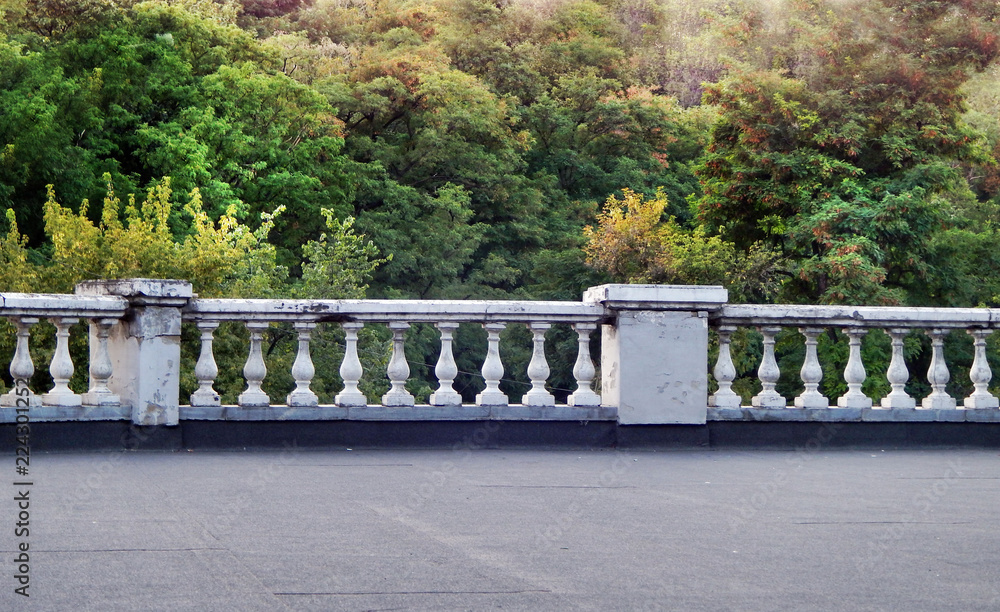scene with white marble parapet and green forest scene with white marble parapet and green forest
