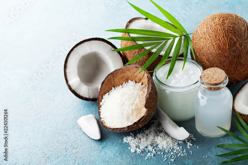 Organic coconut products for spa, cosmetic or food ingredients decorated palm leaves. Natural oil, water and shavings.