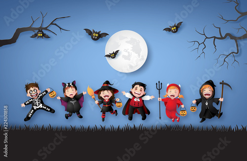 Happy Kids in Halloween Costumes under Moonlight