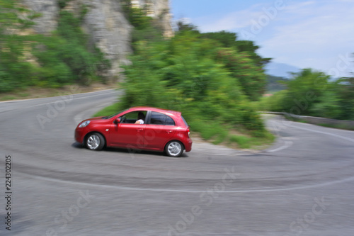 Drifting red car on the road © Константин Артемьев