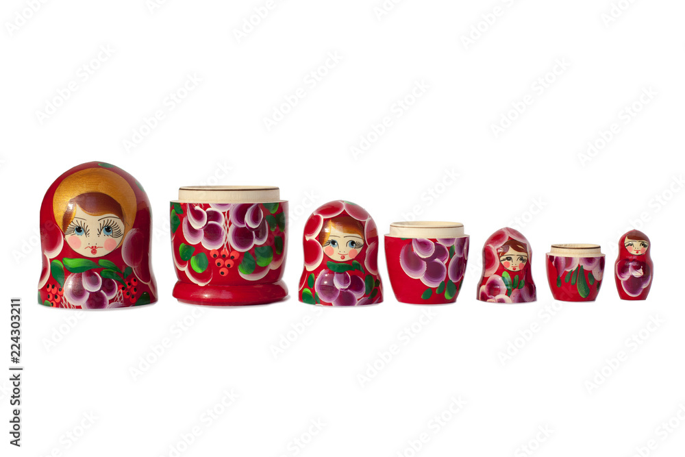 Matryoshka Russian doll souvenir  bright red on white background isolated closeup