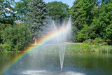Rainbow created by the fountain water spray and the sun