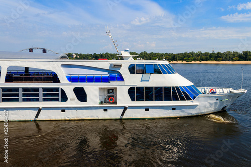 Tourist ship sailing on the Dnieper river in Kiev © olyasolodenko