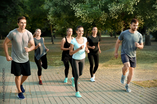 Group of sporty people running outdoors