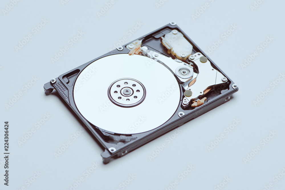 A hard disk drive isolated on white background. A hard disk drive isolated on white background.