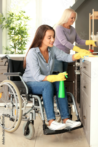 Young woman in wheelchair a...