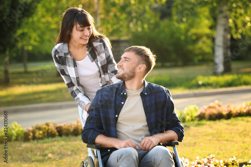 Young man in wheelchair and...