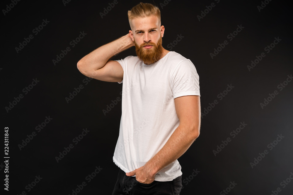 Handsome young guy posing in studio - isolated. Handsome young guy posing in studio - isolated.