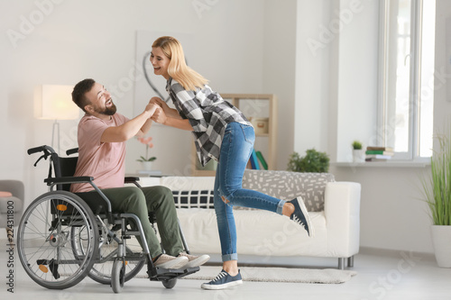 Man in wheelchair with beau...