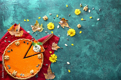 Flat lay composition with tasty pumpkin pie on table