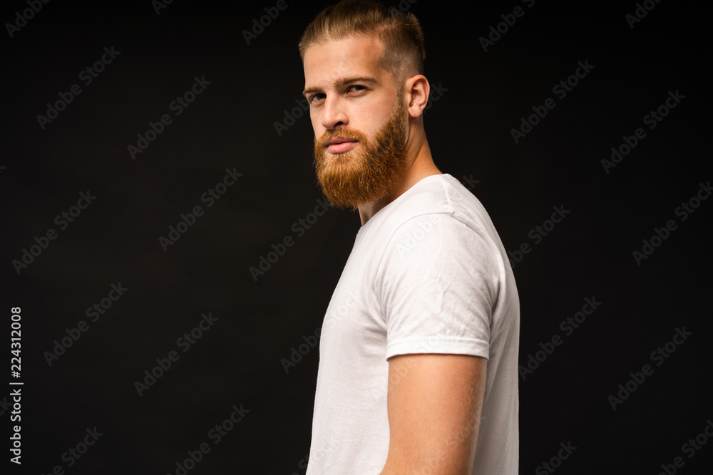 Handsome young guy posing in studio - isolated. Handsome young guy posing in studio - isolated.