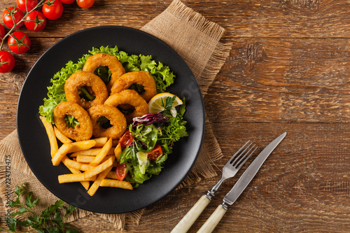 Roasted squid rings with fries