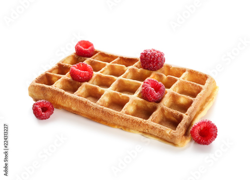 Delicious waffle with raspberries on white background