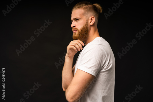 Side view portrait of thinking stylish young man looking away.
