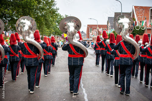 Details from a show and Marchingband or fanfare and drumband with uniforms and Instruments. photo