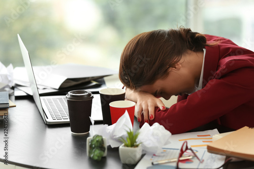 Tired worker with a lot of ...