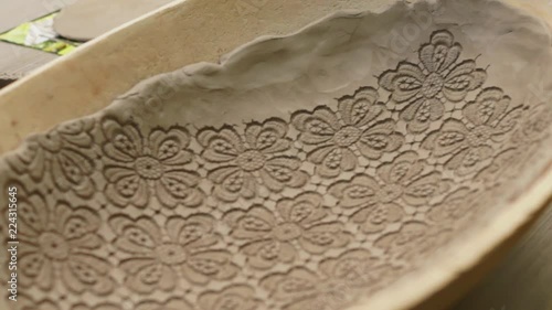 presentation of surface decoration on a  clay vessel i photo