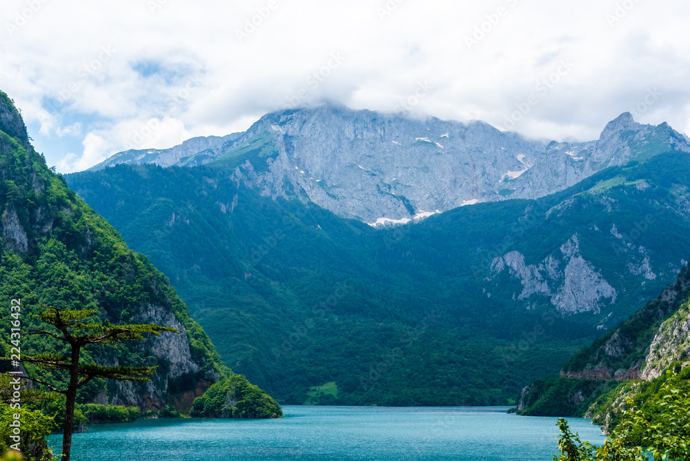 beautiful Piva Lake, mountains and clouds in Montenegro