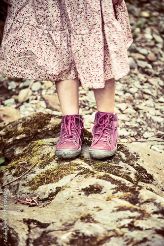 Girl wearing a pink dress and matching boots