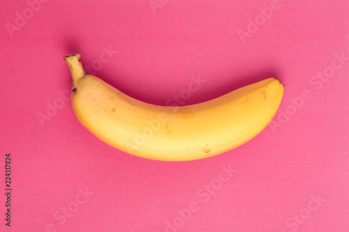 Yellow banana on a pink background