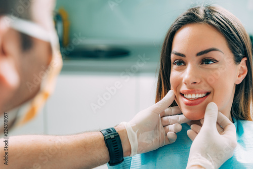 Fototapeta Naklejka Na Ścianę i Meble -  Dentist with beautiful female patient