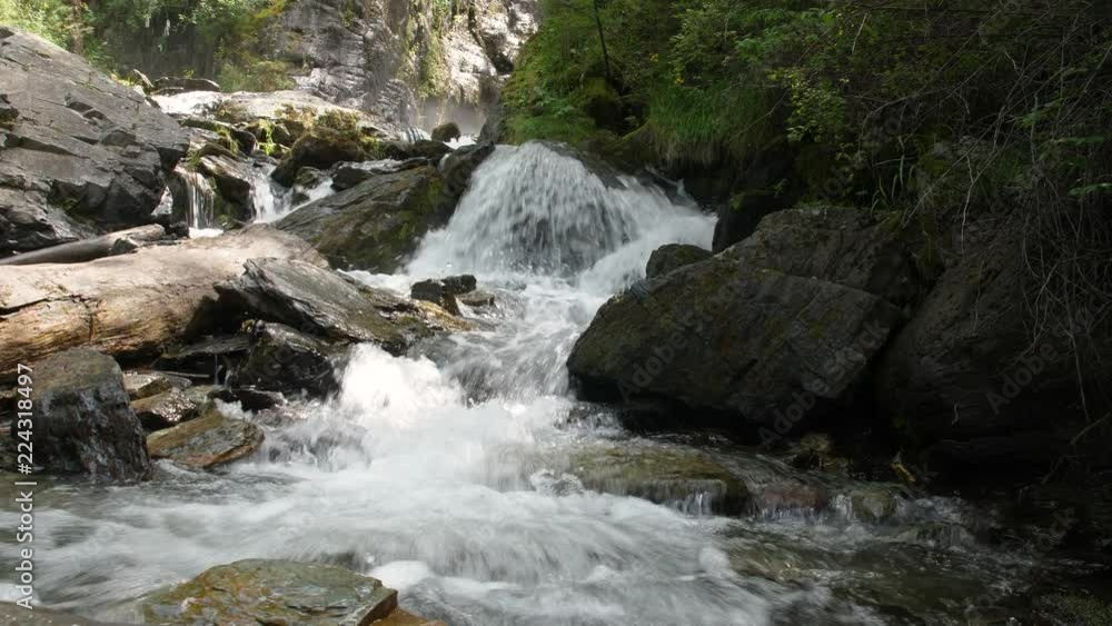 Cascade waterfall. Streams of water among huge boulders. Clean, clear mountain river. 4k Cascade waterfall. Streams of water among huge boulders. Clean, clear mountain river. 4k