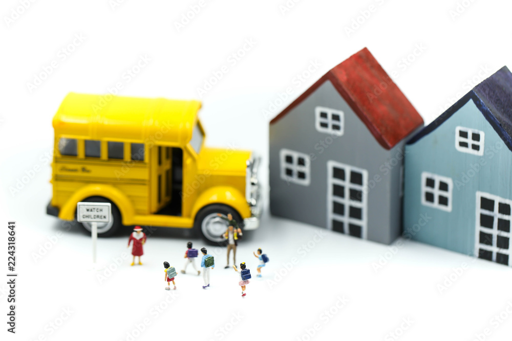 Miniature people : A group of young children getting on the schoolbus,schoolbus transportation education