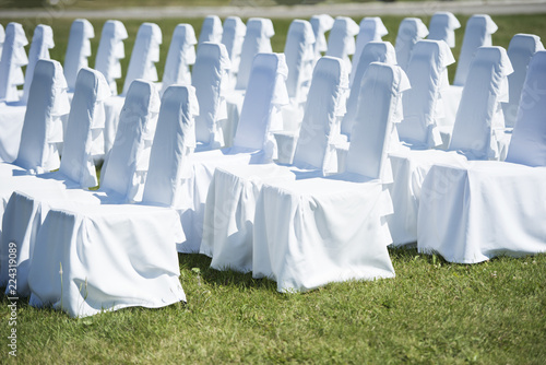 wedding ceremony chairs with white covers