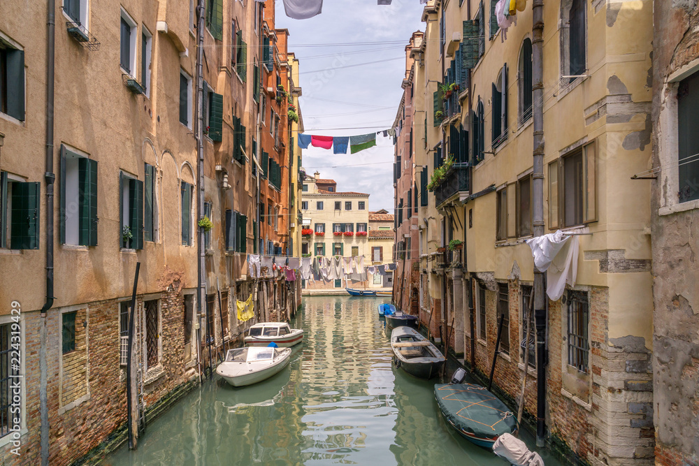 Italian landscape - Venice. Several clothing lines in Venice with canal and boats.