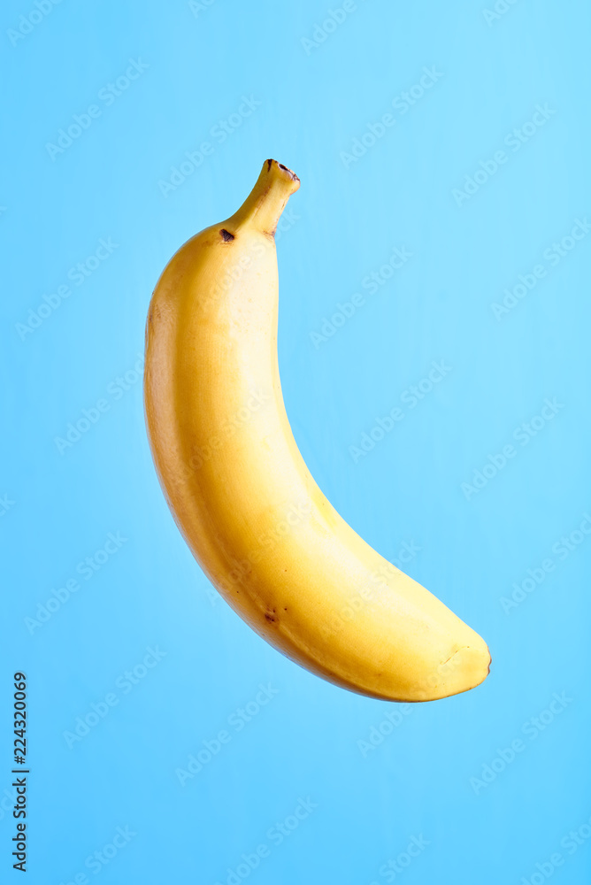 Yellow banana on a blue background Yellow banana on a blue background