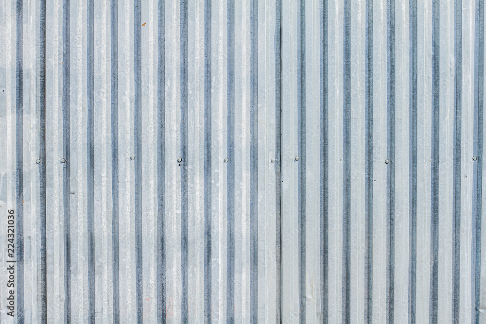 Metal building fence. Galvanized, corrugated texture